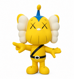 A yellow KAWS Companion figure with X's for eyes, white cloud-like ears, and a black belt.