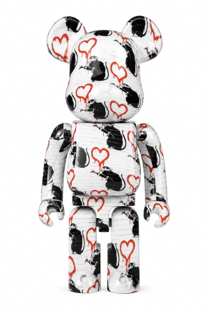 A white Bearbrick toy is covered in black Banksy-style rats and dripping red heart graffiti.