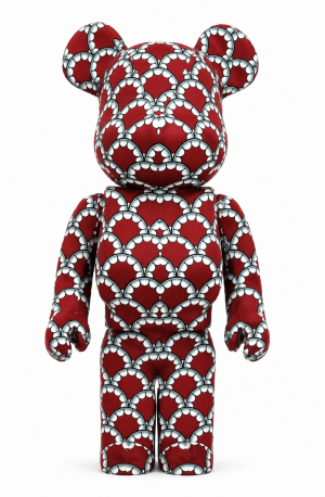 A red Bearbrick toy covered in a repeating pattern of white and black scalloped shapes on a white background.