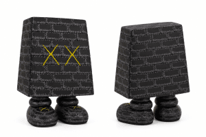 Two black brick-patterned figures with bulbous feet stand on a white background; one has yellow "XX" on its face.