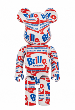 A white bear-shaped figurine covered in the red and blue "Brillo" soap pads logo and text.