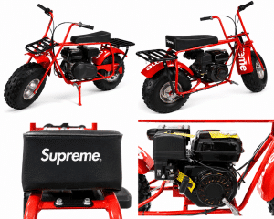 A red mini bike with black seats and black racks, featuring "Supreme" on the seat and fender.
