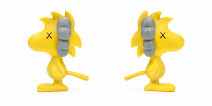 Two identical yellow Woodstock figures, each with X eyes and gray ear muffs, face right on a white background.