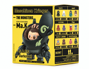 A yellow box for "Maschinen Krieger - THE MONSTERS" features a dark gray mech with a pilot inside.