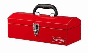 A shiny red toolbox with a black handle, a silver latch, and a "Supreme" logo on the front.