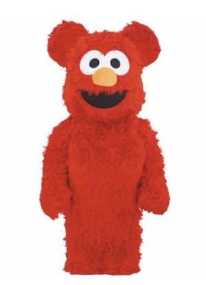 A full-body, bright red, furry Elmo costume stands against a plain white background, smiling.