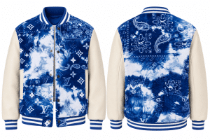 A front and back view of a blue and white tie-dye varsity jacket with cream leather sleeves.