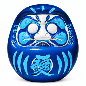 A glossy blue Daruma doll with white and light blue facial features and Japanese characters "愛" on its belly.