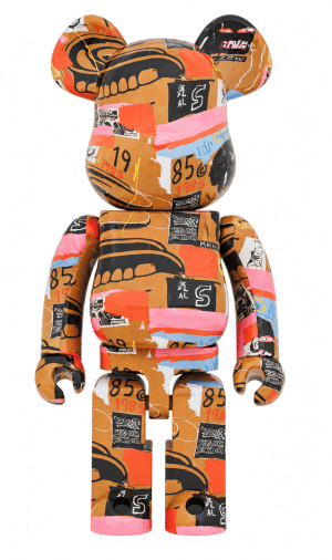 A Bearbrick figure with a brown, orange, pink, and blue abstract design, including numbers like "85" and "1985."