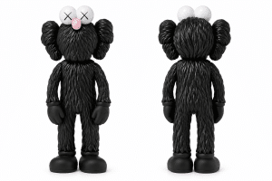 A black furry KAWS Companion figure is shown from the front and back against a white background.