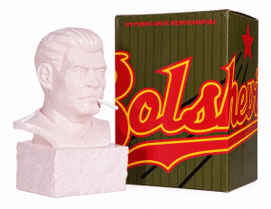 A pink bust of Stalin with a cigarette in his mouth stands next to a box labeled "Bolshevik."
