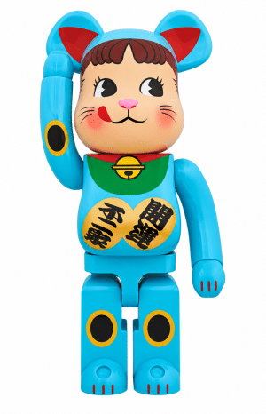 A blue Be@rbrick figure with a cat-like face, one paw raised, and Japanese text "開運" and "招福" on its chest.