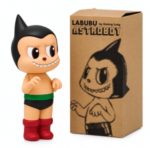 A Labubu Astro Boy vinyl figure with red boots and green belt stands next to its brown box with "ASTROBOY" text.