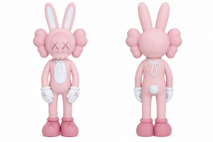 A pink KAWS "BFF" vinyl figure, styled as a bunny, is shown from the front and back.