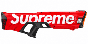 A red water gun with "Supreme" in white text on its side, and a black handle and trigger.