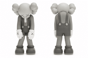 A monochrome KAWS Companion figure in overalls with "X" eyes and hands, shown from the front and back.